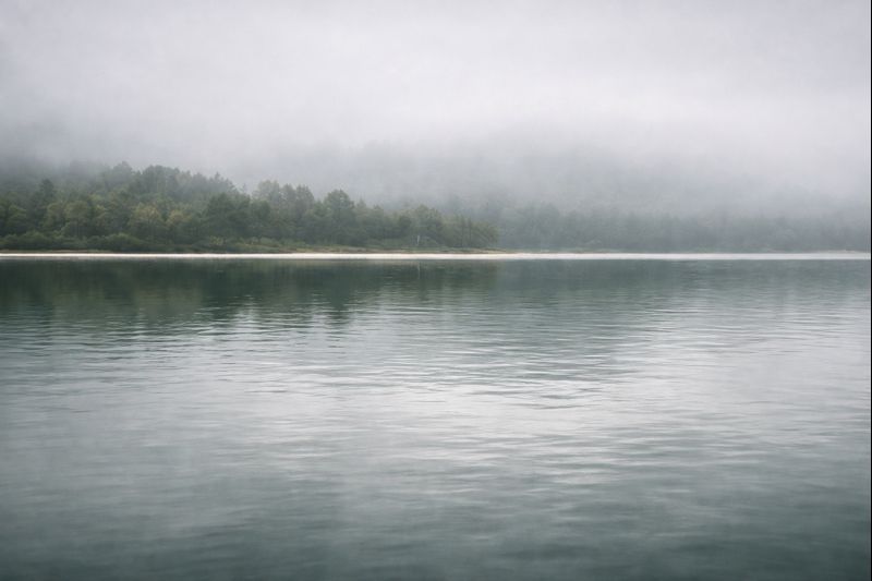 Still lake in mist
